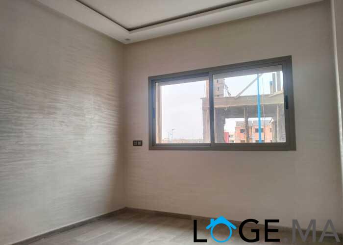 Appartement de 113 m2 de 2 façades dans une R+2 escalier privative a al bosstane El jadida.