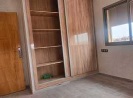 Appartement de 113 m2 de 2 façades dans une R+2 escalier privative a al bosstane El jadida.