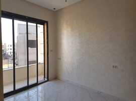 Appartement a vendre dans R+2 ,de 153 m2 près albousstane a el jadida.